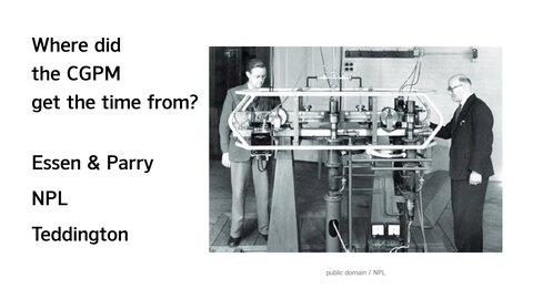 Essen and Parry standing next to their atomic clock
